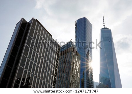 A low angle view of skyscrapers in New York City in a cloudy day