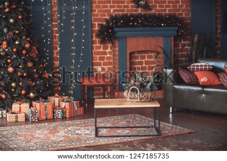 Image of chimney and decorated Christmas tree with gift. Christmas interior.
