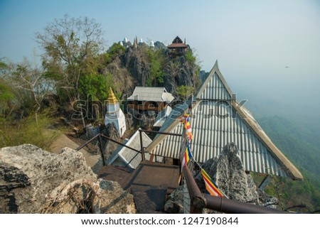 Wat Chaloem Phrakiat Phrachomklao Rachanuson, Chae Hom Picture, Pagoda on rock mountain in the morning, Thailand.