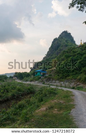 Vertical picture of huge Hpan Pu Mountain located in Hpa-An, Myanmar