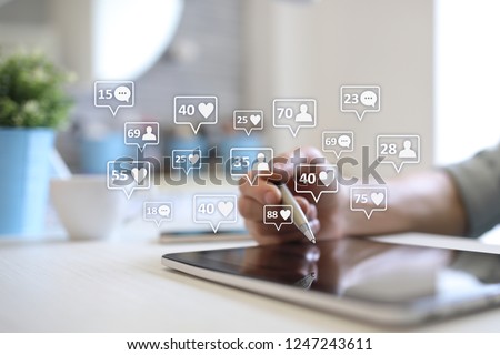 SMM, likes, followers and message icons on virtual screen. Social media marketing. Business and internet concept. Royalty-Free Stock Photo #1247243611