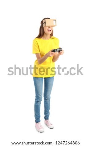 Young woman using cardboard virtual reality headset, isolated on white