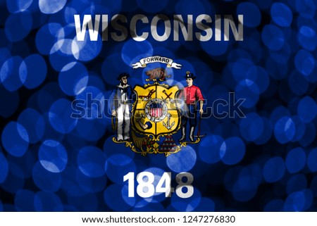 Wisconsin abstract blurry bokeh flag. Christmas, New Year and National day concept flag. United States of America.