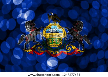 Pennsylvania abstract blurry bokeh flag. Christmas, New Year and National day concept flag. United States of America.