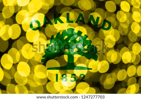 Oakland, California abstract blurry bokeh flag. Christmas, New Year and National day concept flag. United States of America.