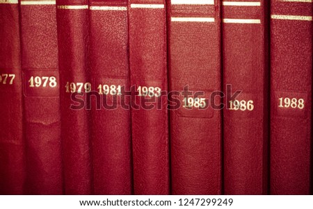 Vintage background from stack of old books, arranged vertically. Collected works. Toned.