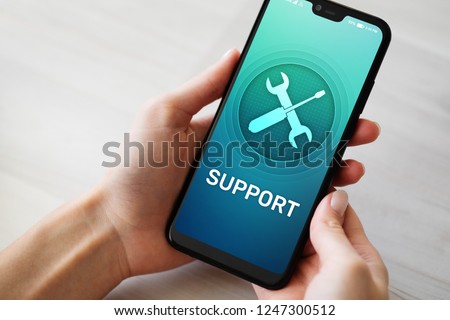 Support, Customer service icon on mobile phone screen. Call center, 24x7 assistance. Royalty-Free Stock Photo #1247300512