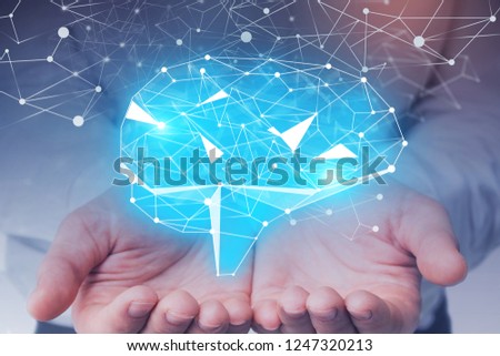 Hands of unrecognizable businessman in white shirt holding brain hologram. Concept of artificial intelligence. Toned image double exposure