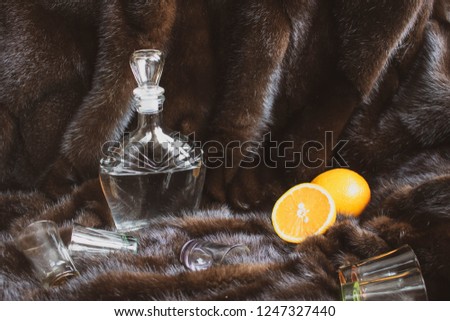brown carafe of vodka holiday table fruit fur background