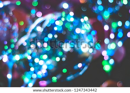 Blurred Christmas bokeh background. Color unfocussed lights. Circular bokeh sparkle glitter lights background. Happy New Year