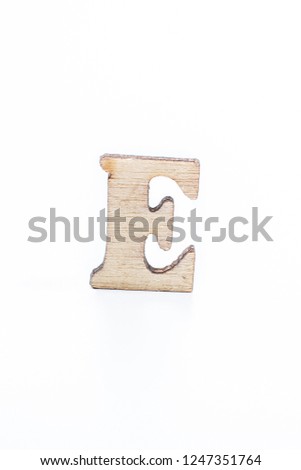 Wooden letter E on a white background

