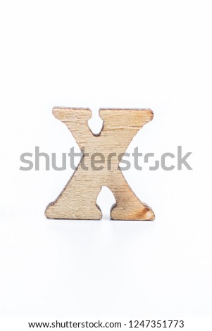 Wooden letter X on a white background