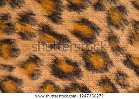 fabric texture with leopard colour textured pattern 


