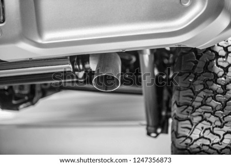 Large size tires and exhaust pipes for off-road vehicles