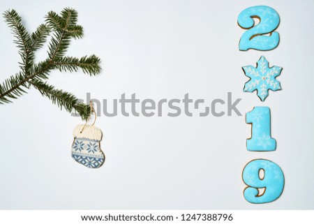 Gingerbread cookies on white background. Flat lay festive composition with copy space. New 2019 year holiday frame.