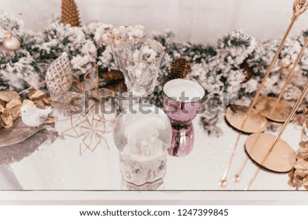 bears in a glass bowl, toy glass ball on the table