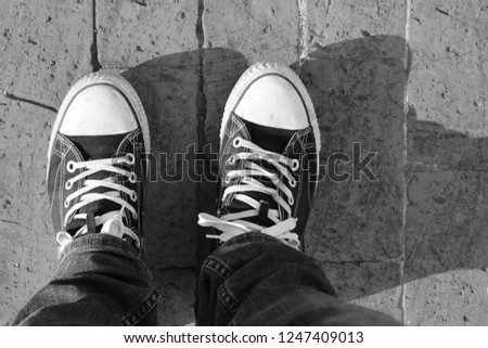 A top view of a man's legs and shoes. Street wear fashion concept image. 
