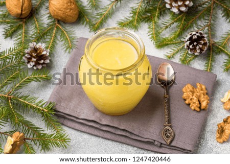 Homemade lemon curd in glass jars on the table. Concept Christmas.