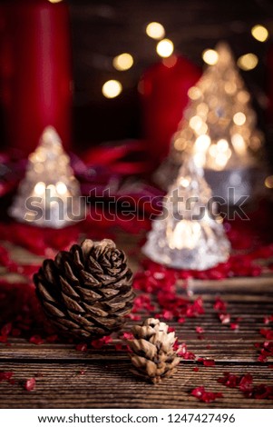 Christmas or new year background with decorations on wooden table with warm lighting.