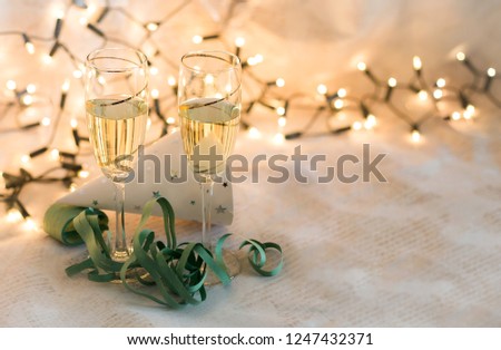 new year party elements and glasses with champagne card with space to write