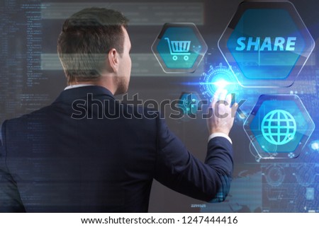 Business, Technology, Internet and network concept. Young businessman working on a virtual screen of the future and sees the inscription: Share