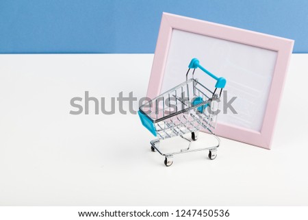 Empty grocery toy  shopping cart on a table