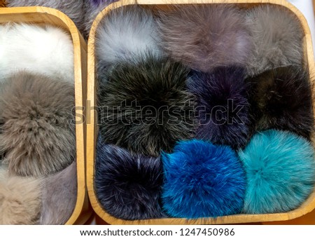 Fur, colored natural fur texture. Closeup photo. Black, brown, grey fur.