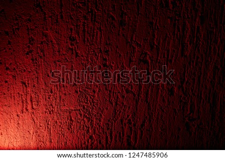White glow on a red textural background