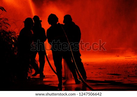 Blur silhouette firefighter, Firefighters are helping fight the fire.