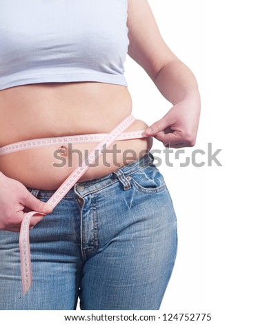 fat woman measuring her stomach Royalty-Free Stock Photo #124752775