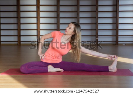 Beautiful woman practicing yoga indoors Relaxation and meditation.