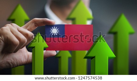 Nation Growth Concept, Green Up Arrows - Businessman Holding Card of Taiwan Flag