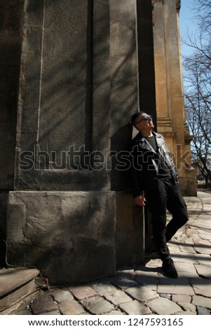man in sunglasses on the background of architecture