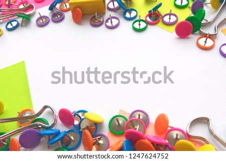 Colorful stationary, back to school, office, business and education concept. School and office supplies paper clips, pins, notes, stickers on white background. Mock up. Close up photography