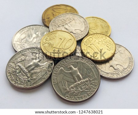 Euro and dollar cents on white background