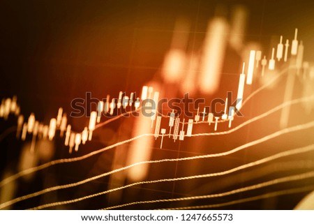 Stock market data on digital LED display. A daily market price and quotation of prices chart and candle stick tracking for Forex trading.