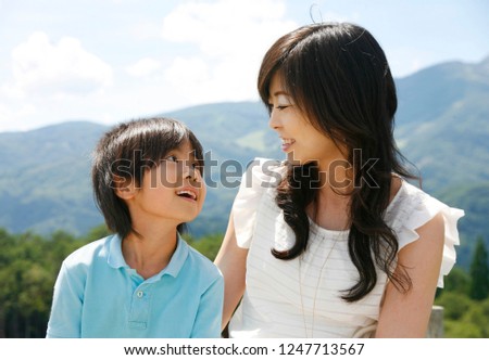Japanese mother and son who are on the plateau
