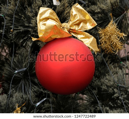 Christmas decoration hanging on a pine tree before New Year Day
