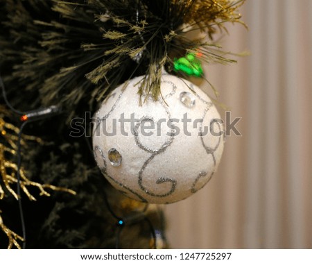 Christmas decoration hanging on a Christmas tree before New Year Day