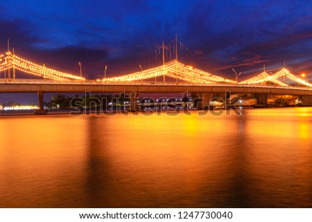 Twilight light at the bridge over the river