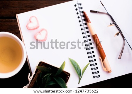 hot green tea , healthy fresh drink. copy space on white paper note book.