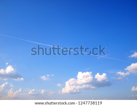 Blue sky with white clouds below. The middle line has a white line on the diagonal and the top has space for the text.