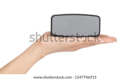 Hand holding Small speakers isolated on a white background