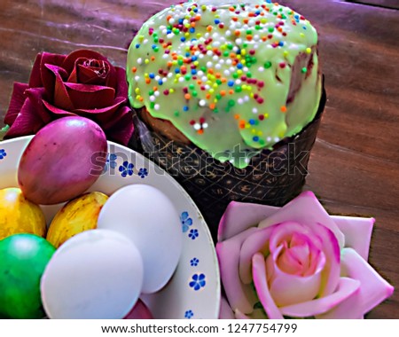 pictured in the photo Sweet Easter cakes with colorful eggs on table in room