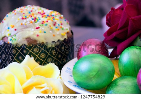 pictured in the photo Sweet Easter cakes with colorful eggs on table in room