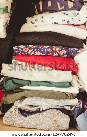 folded colorful clothes/toned photo