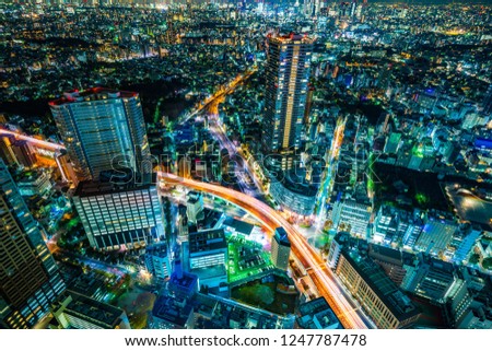 Asia Business concept for real estate & corporate construction - panoramic modern city skyline night view with expressway in Ikebukuro district, Tokyo, Japan