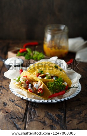 Pork tacos with capsicum and sour cream