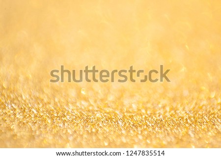 gold abstract bokeh glitter texture background, filled with shiny gold glitter background.selective focus.