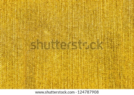 Texture of yellow jeans as a background